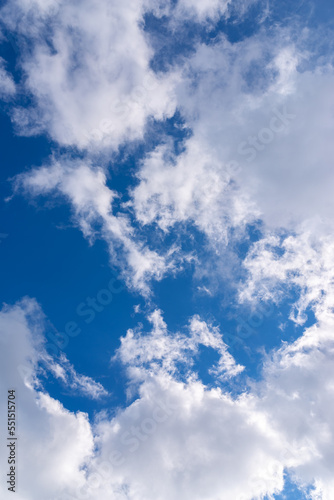 Dramatic blue sky with white clouds.
