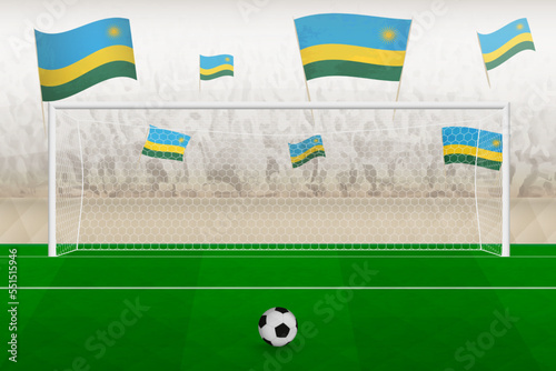Rwanda football team fans with flags of Rwanda cheering on stadium, penalty kick concept in a soccer match.