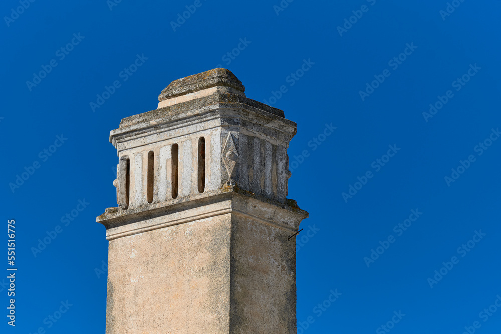 Traditional chimney on the roof of a houses in Olhao, Faro district, Algarve, Portugal