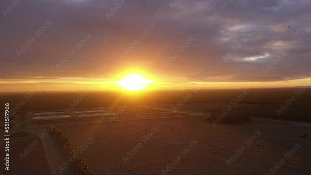 Early morning sunrise peaceful drone flight over agriculture field and farmland in California. Early morning sunrise peaceful drone flight over agriculture field and farmland in California.