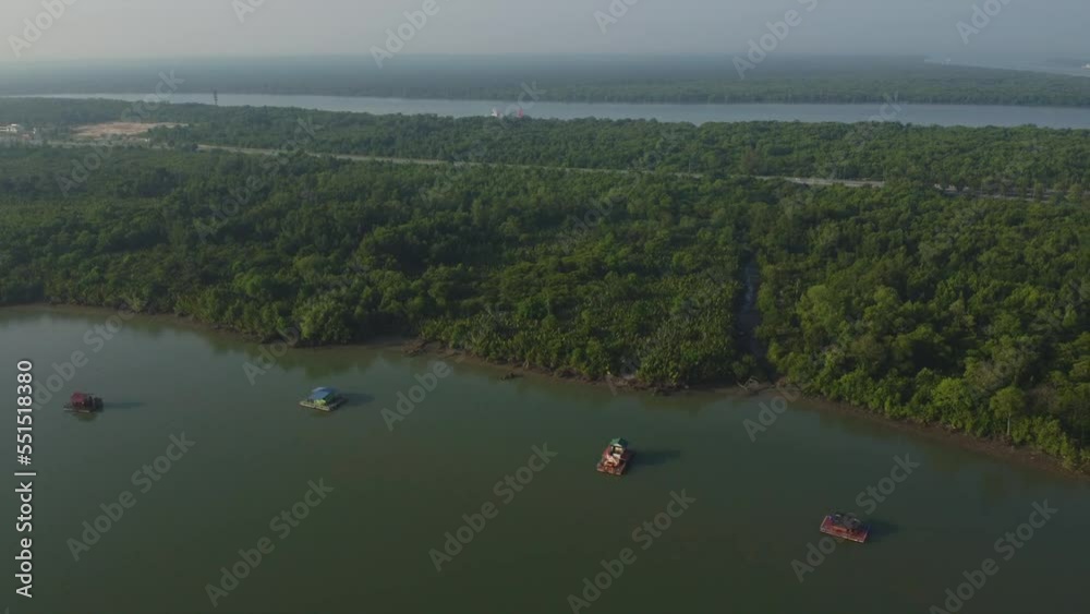 Drone View of floating house on Bagan Lalang river, Sepang, Malaysia Drone View of floating house on Bagan Lalang river, Sepang, Malaysia