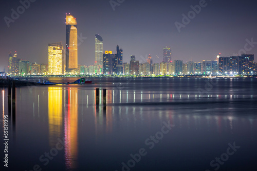 Cityscape with skyscrapers of Abu Dhabi at night  capital of United Arab Emirates
