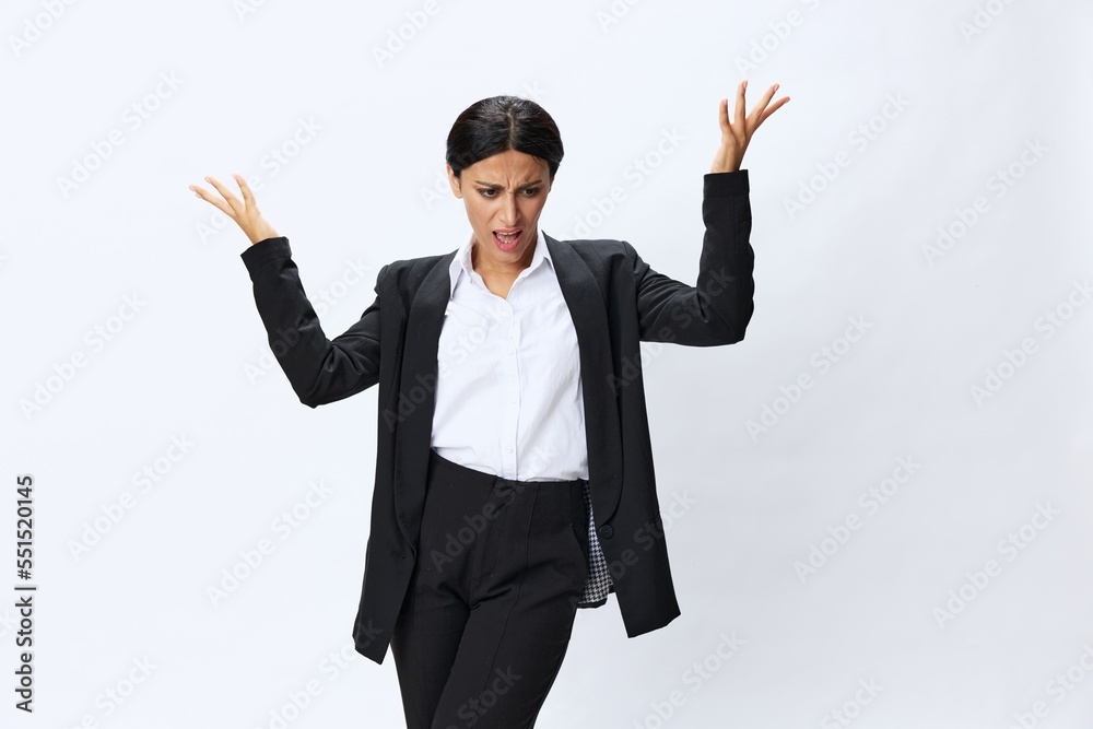Business woman in black business suit shows signals gestures and emotions on white background, freelancer job online time management, teacher science Business woman in black business suit shows signals gestures and emotions on white background, freelancer job online time management, teacher science
