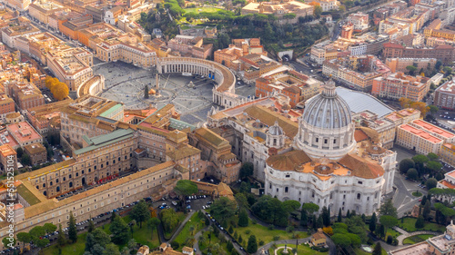 Aerial view of Papal Basilica of Saint Peter in the Vatican located in Rome, Italy. It's the most important and largest church in the world and residence of the Pope. Around it are the Vatican gardens photo