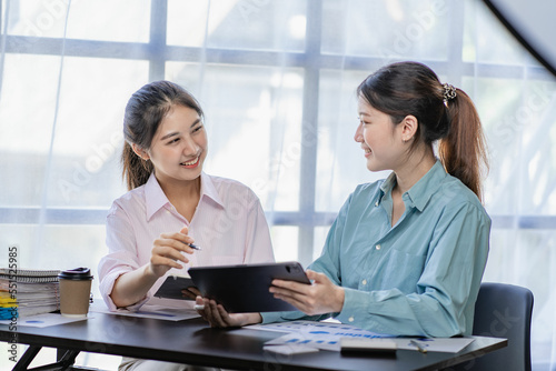Business meeting.Two women discussing business in modern office.General account manager working on startup project on laptop. Financial accounting presentation, teamwork concept