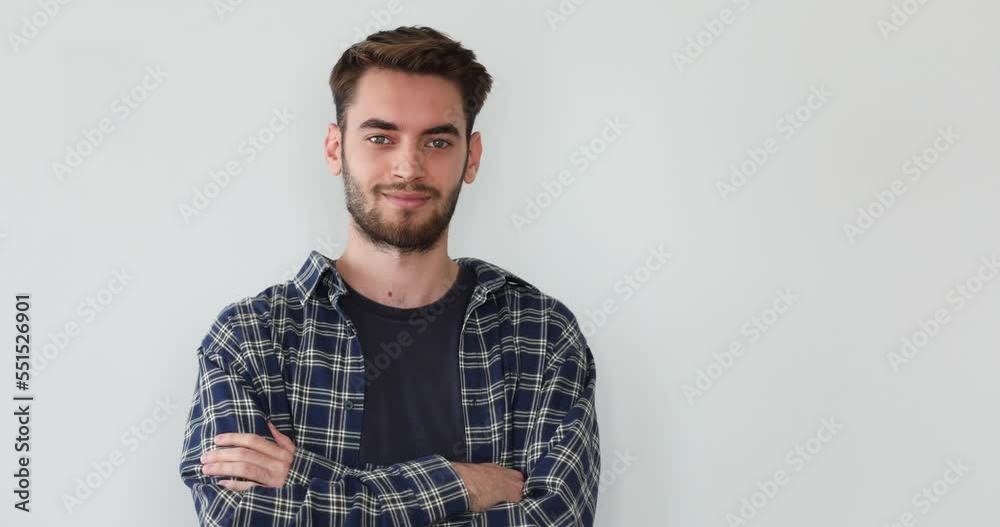 young man standing on grey background young man standing on grey background