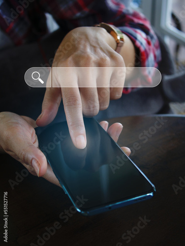 hand holding a smartphone to use the search bar find information data and more on the internet