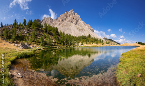 Summer view of Lauzet Lake above the village of Saint-Crepin in the Hautes-Alpes. Alps, France
