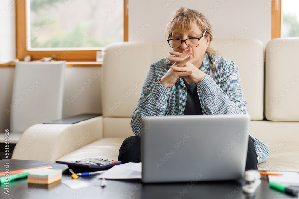 Active mature woman using a laptop for remote work from the home office. Video conference, video meeting. Senior teacher leads webinar
Active mature woman using a laptop for remote work from the home office. Video conference, video meeting. Senior teacher leads webinar