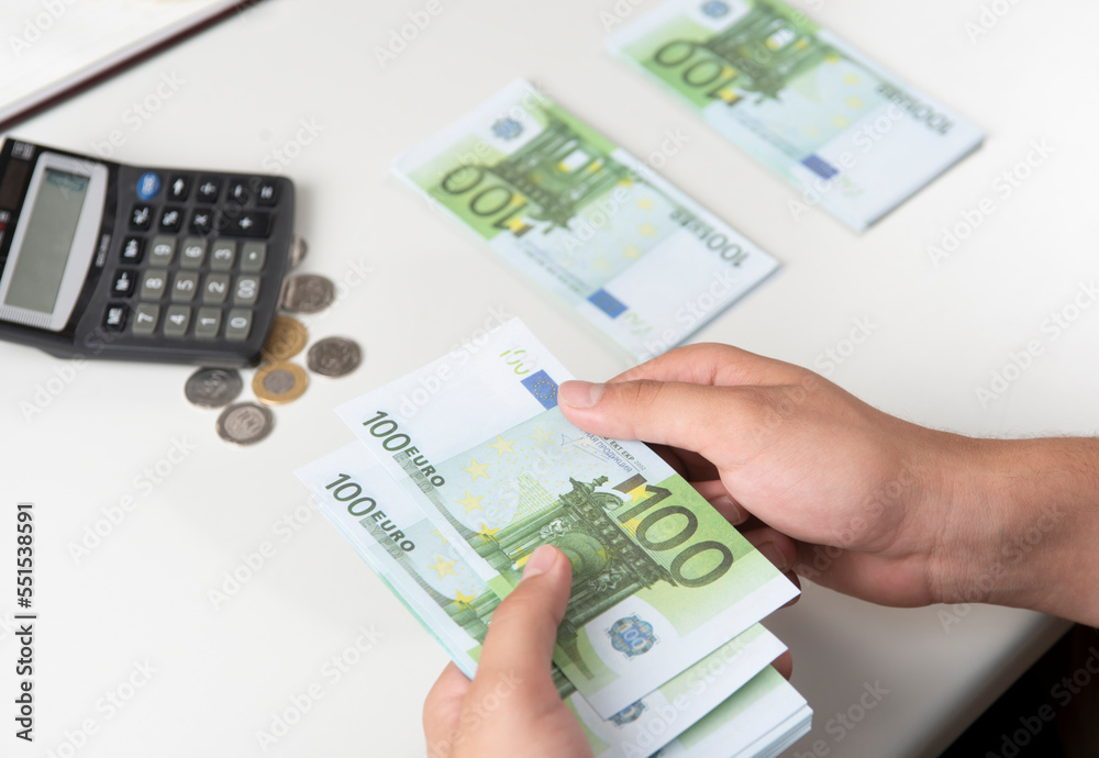 Man counting money, economy concept, allocation of money.Euro. Crisis after the covid-19 epidemic .Dollar falling or rising. Man counting money, economy concept, allocation of money.Euro. Crisis after the covid-19 epidemic .Dollar falling or rising.