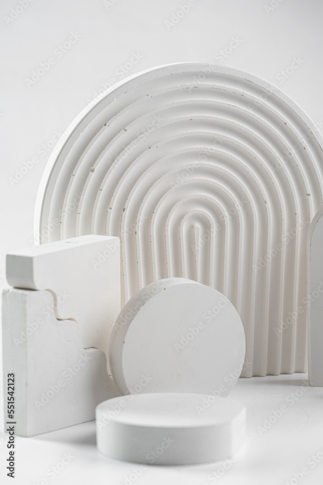 Naklejka premium White props for product photography on white seamless background - half-circles, oval doors, rippled arch, zig-zag stairs