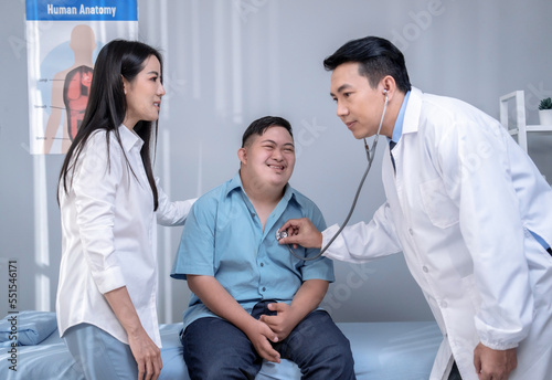 Asian mother and son coming for check-ups and consulting health problems with doctors.