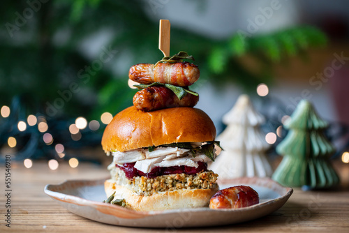 Christmas brioche bun with turkey, stuffing, cranberry sauce and pigs in blankets
