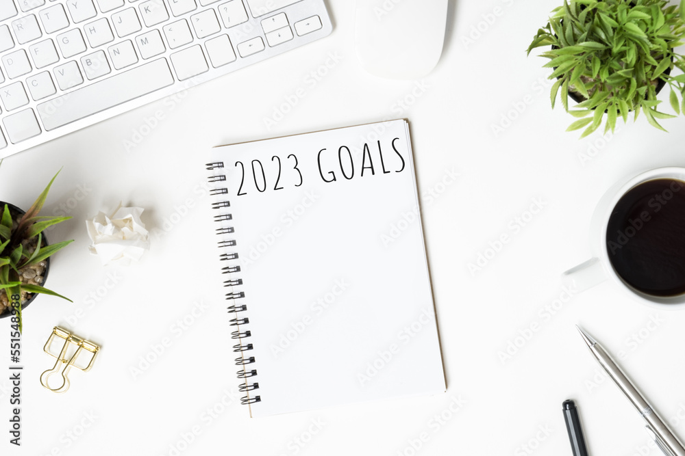 Notebook with 2023 goals text on it to apply new year resolutions and plan. Notebook with 2023 goals text on it to apply new year resolutions and plan.