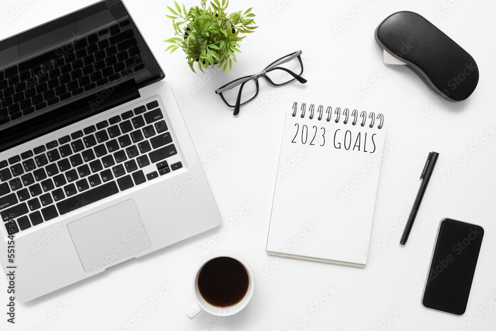 Notebook with 2023 goals text on it to apply new year resolutions and plan. Notebook with 2023 goals text on it to apply new year resolutions and plan.