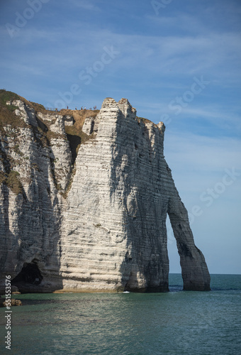 The cliffs of Etretat from the sandy beach of Etretat at high tide