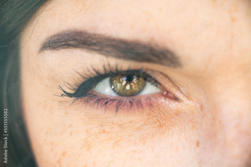 Eye of a woman showing all the determination of her character Eye of a woman showing all the determination of her character