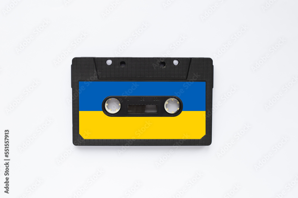 Magnetic old tape cassette for audio painted in the color of the ukrainian flag isolated on a white background Magnetic old tape cassette for audio painted in the color of the ukrainian flag isolated on a white background