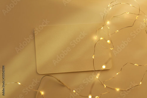 Empty Blank texture canvas paper card with white glow garland. Light and shadows minimalism style template copy space background. Flat lay, top view. photo