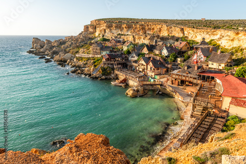 Famous Popeye Village in Anchor Bay, Mellieha, Malta. Turquoise sea water and blue sky. photo