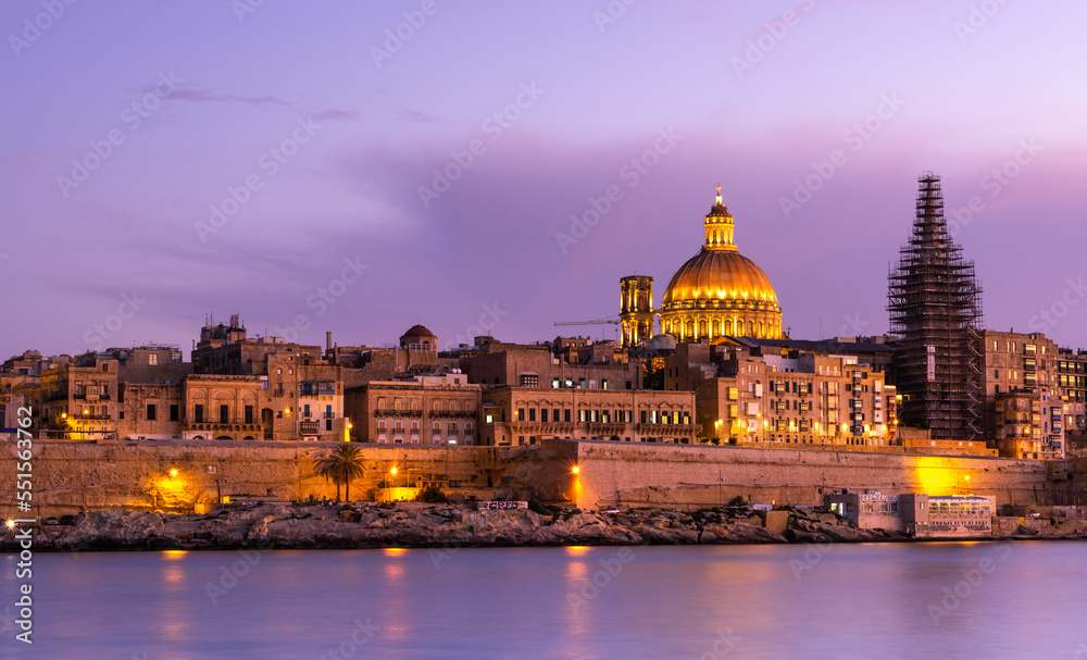 Illuminated skyline of Valletta capitol of Malta at sunset