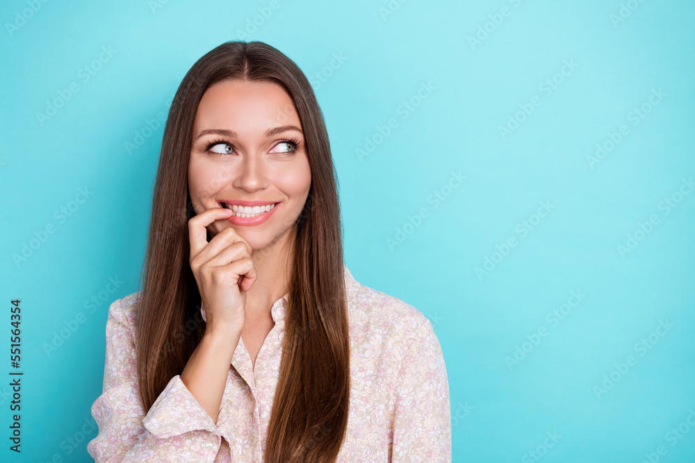Photo of nice young woman look promo wear pink shirt isolatedon blue color background Photo of nice young woman look promo wear pink shirt isolatedon blue color background