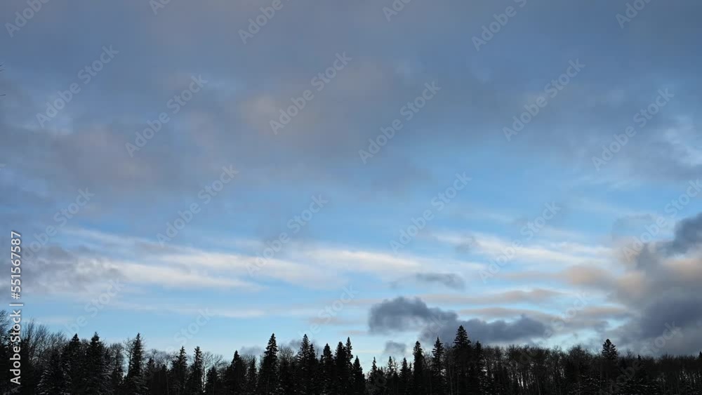 Time lapse of late day clouds in a light blue sky moving from left to right above a forest of spruce, pine and aspen trees.
Time lapse of late day clouds in a light blue sky moving from left to right above a forest of spruce, pine and aspen trees.