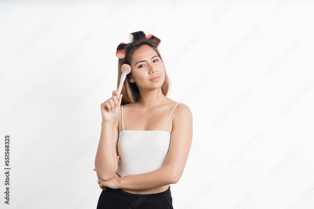 Beauty asian woman applying makeup with brush of cheek isolated on white background.