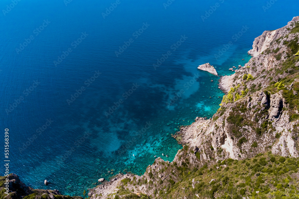 view from the rocks of the blue sea on a sunny day