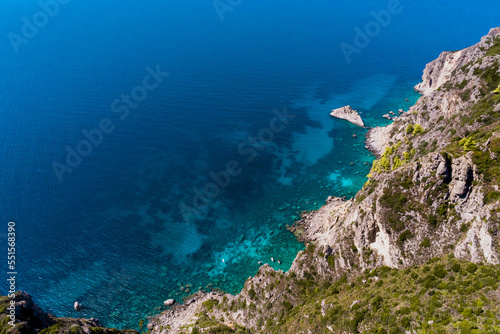 view from the rocks of the blue sea on a sunny day