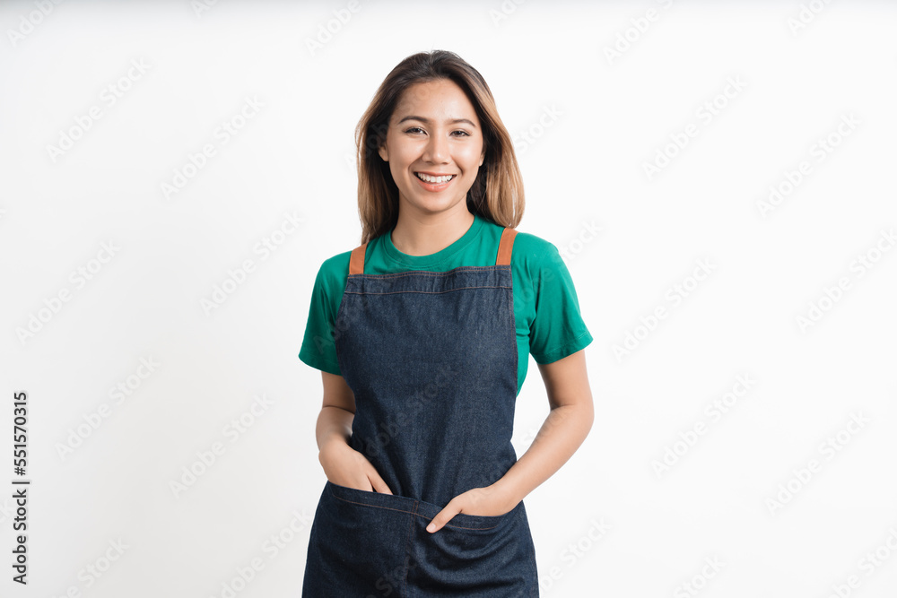 Cheerful young pretty asian woman green t-shirt and apron coffee owner isolated on white background. looking camera. Cheerful young pretty asian woman green t-shirt and apron coffee owner isolated on white background. looking camera.