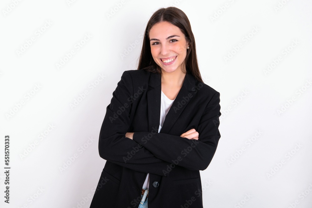 Young caucasian woman wearing jacket over white background happy face smiling with crossed arms looking at the camera. Positive person. Young caucasian woman wearing jacket over white background happy face smiling with crossed arms looking at the camera. Positive person.