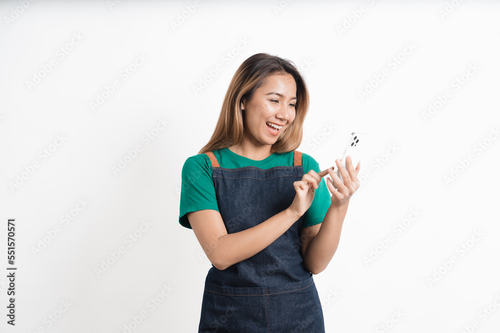 Young Asian business owners are excited by the good news while playing on their mobile phones isolate on white background, clipping path.