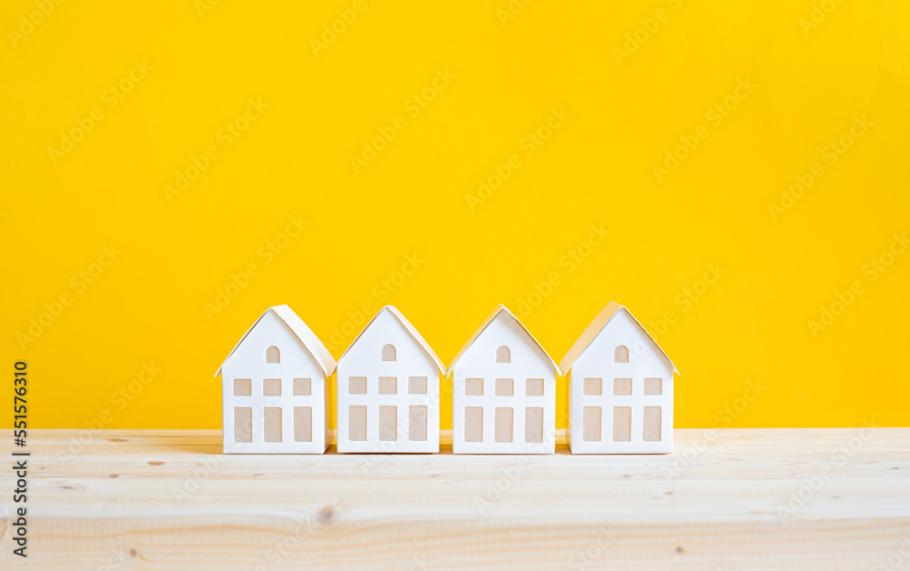 Property or real estate concepts with house model on desk. banking and investment.