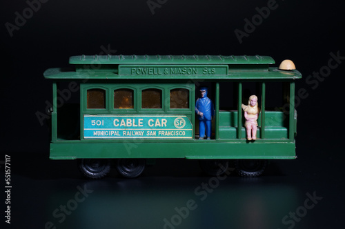 San Francisco cable car vintage toy on black background.
