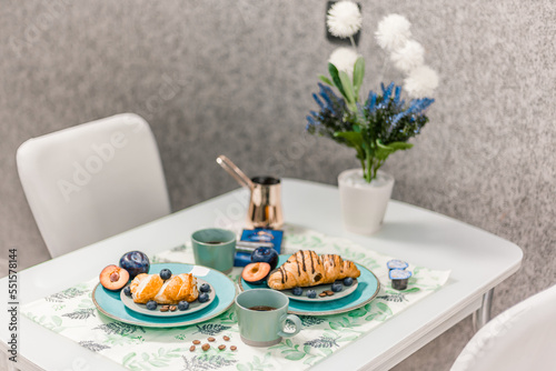 Wallpaper Mural breakfast served on the table close-up of coffee and croissants with berries layout Torontodigital.ca