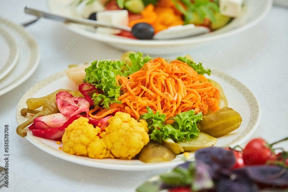 Assorted salted vegetables on a plate. Assorted salted vegetables on a plate.