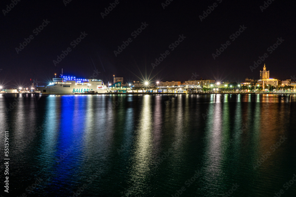 Night view of port in Malaga, Spain on November 24, 2022 Night view of port in Malaga, Spain on November 24, 2022