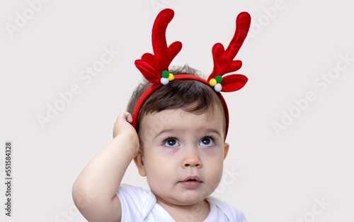 kid crying baby woman with christmas handbag fir tree reindeer antlers.child pointing with finger empty space toddler angry hands on mouth tears girl looking at wine glass or dragging headband
