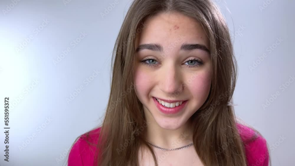Happy mature young girl lady sitting on couch, holding video call with friends, head shot close up portrait. Web cam view laughing middle aged woman having fun, talking with grown up children online Happy mature young girl lady sitting on couch, holding video call with friends, head shot close up portrait. Web cam view laughing middle aged woman having fun, talking with grown up children online