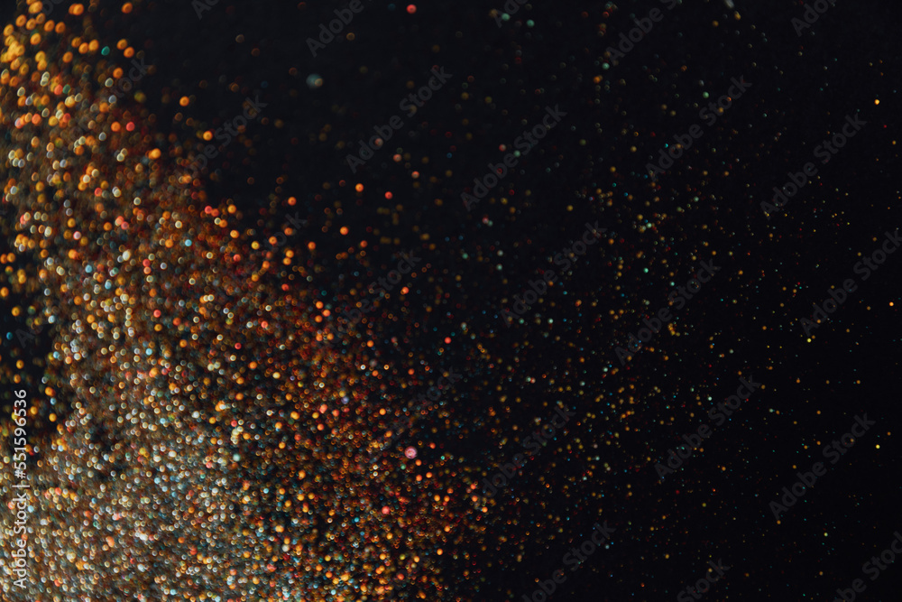 Abstract background of blurred colourful glitter for design. Lights bokeh dis focus. Christmas background, copy space