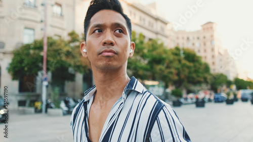 Young man tourist walks along the square of the old city