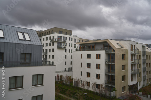 Concept of modern architecture for a better living. Contemporary medium-sized flat building in Europe. Sunset in a European middle house apartment