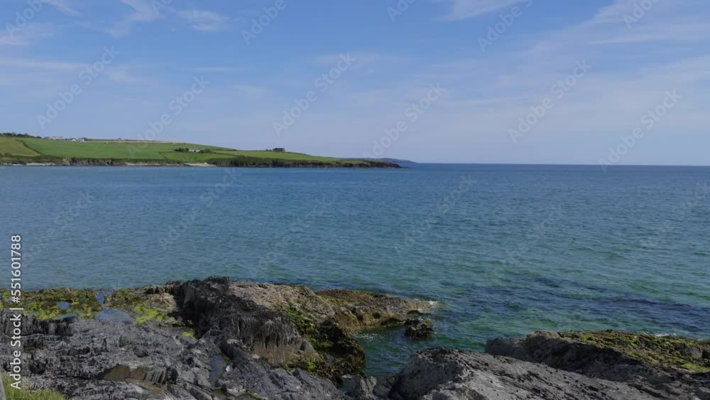 The rocky coast of the Atlantic Ocean in Ireland in summer. Sea landscape on a sunny day. The rocky coast of the Atlantic Ocean in Ireland in summer. Sea landscape on a sunny day.