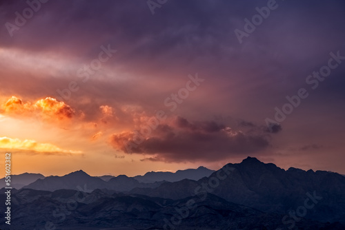 Dramatic colorful clouds over mountains at sunset, Dahab, Egypt