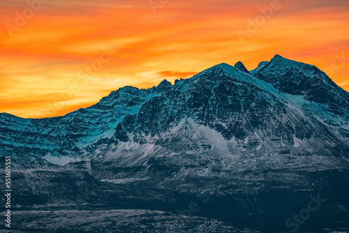 sunset in snowy mountains