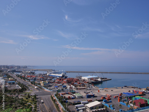Cargo ships are moored in the port to load cargoes