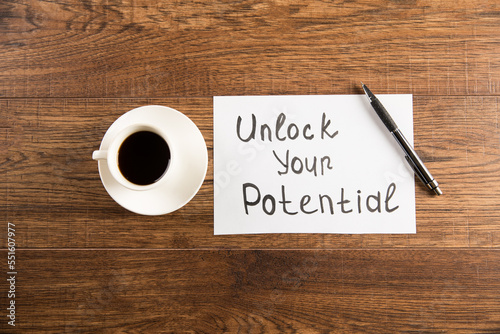 The inscription Unlock your potential and coffee