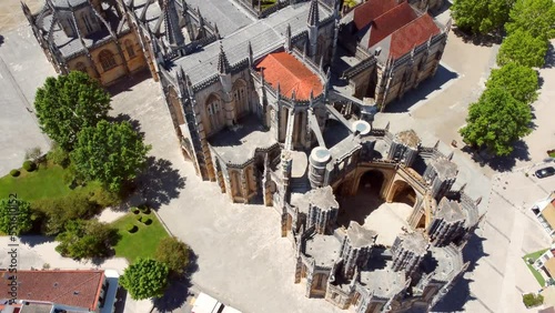 Aerial pan footage of historic UNESCO heritage site monument of unfinished chapel Capelas Imperfeitas in Batalha, Portugal photo