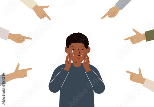 The concept of public condemnation, victim blaming and bullying. Crying depressed boy. The fingers point at the character and hate him. Internet cyberbullying.